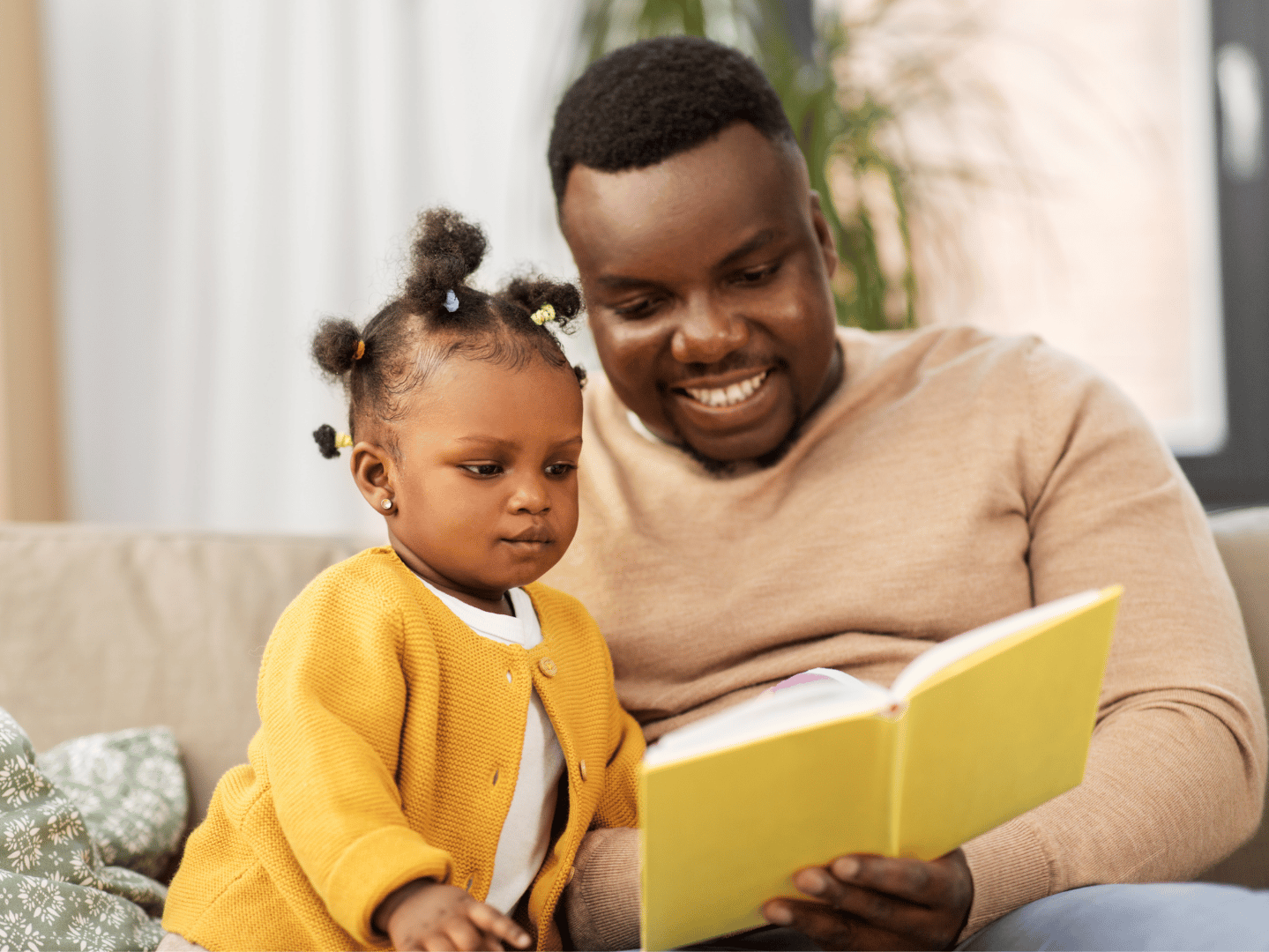 photo of father reading to child