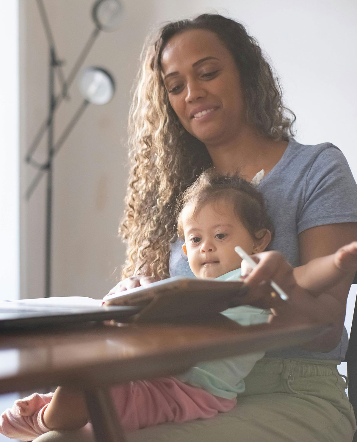 Mother and daughter with disabilities sitting in front of computer