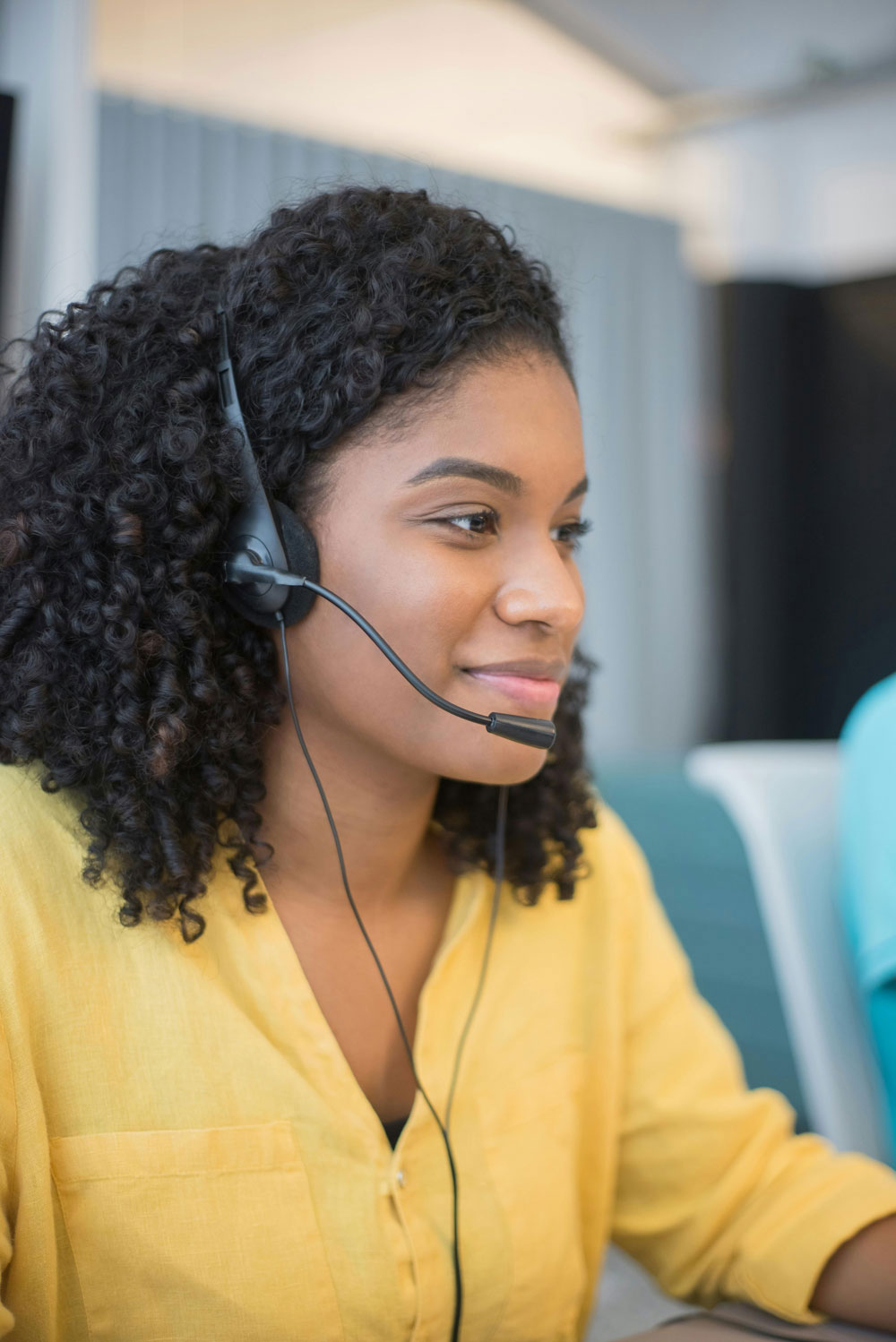 Bastrop-County-Cares-Community-Resources-Call-Center-Support-1000x1498 African American Call Center Representative with headphones