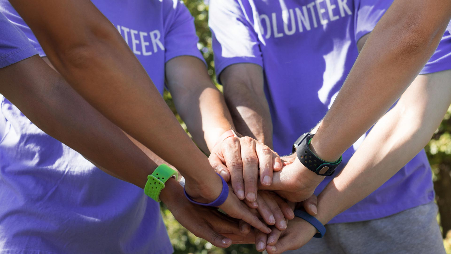 Volunteers with hands joined