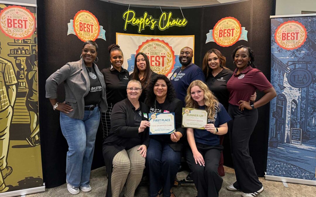 Bastrop County Cares wins Best Non-profit of the year team photo with award