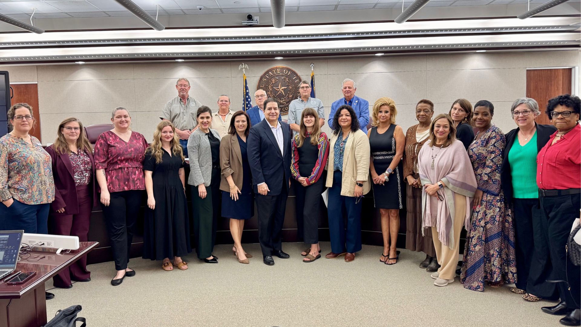 Community partners and Bastrop County Cares representatives stand with county officials at the Bastrop County Commissioners Court for the proclamation recognizing March as Traumatic Brain Injury Awareness Month.
