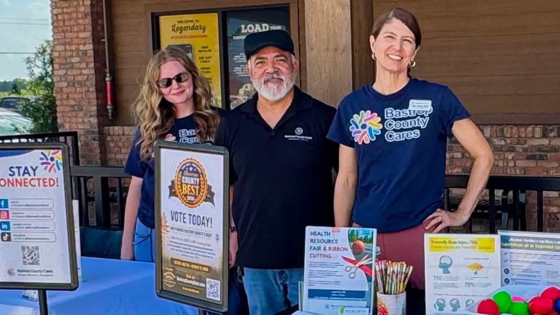 Bastrop County Cares staff and volunteers share community resources with guests during the Texas Roadhouse Bastrop soft opening event.
