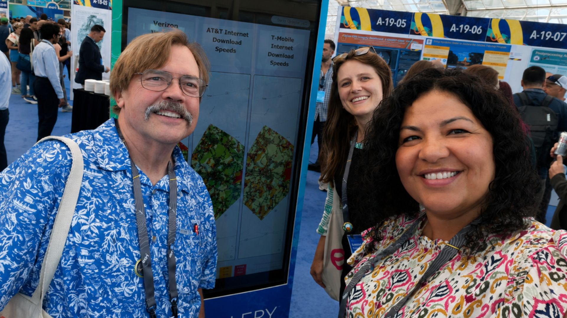 Bastrop County Cares team members at the Esri User Conference showcasing GIS mapping and Broadband Equity initiatives to improve community access and data-informed services.